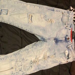 Some jeans there white and blue Encripted